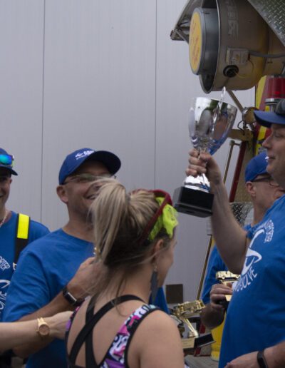 winner holding a trophy